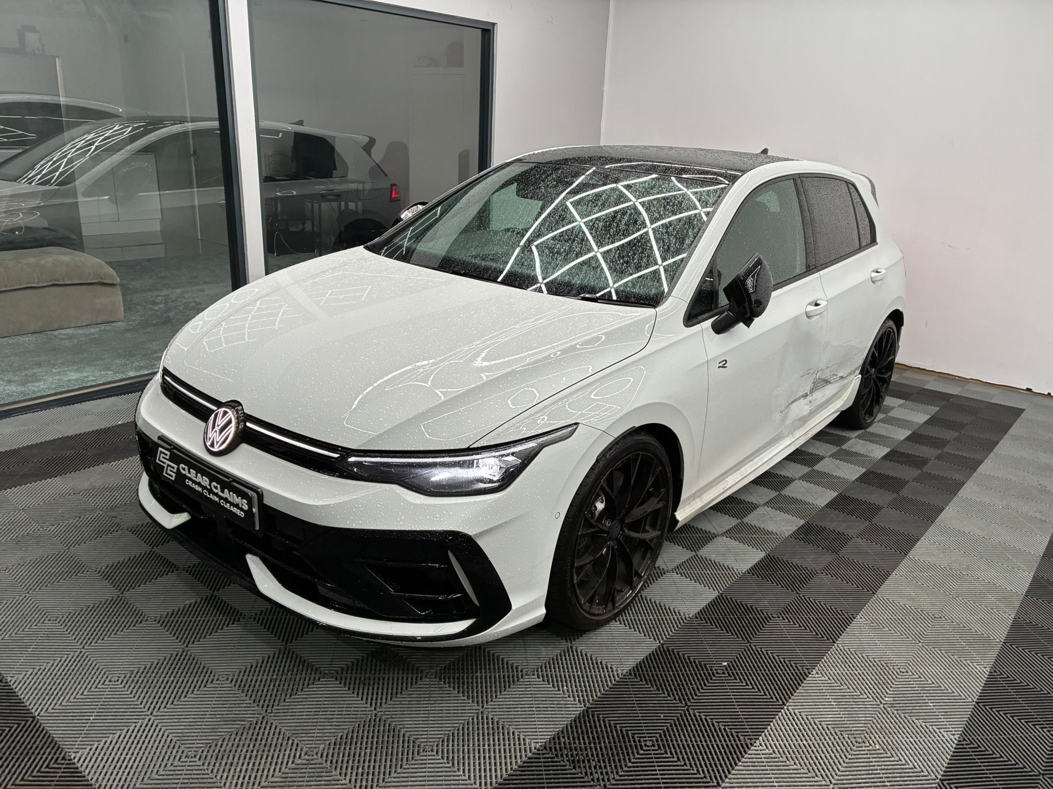 VW Golf R in Clear Claims showroom